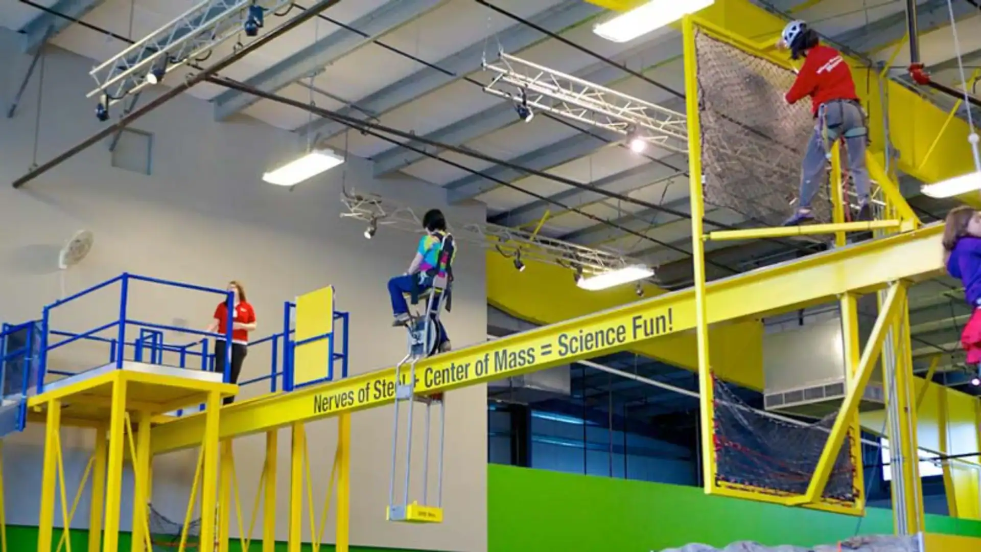 child at the science center riding a bike