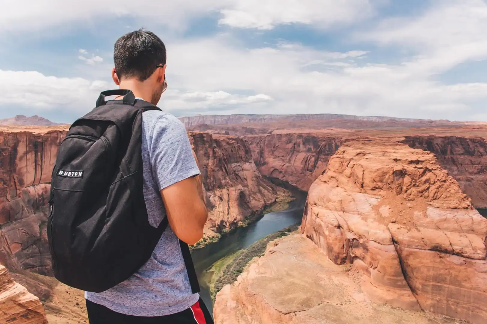 Backpacker looking down the canyon