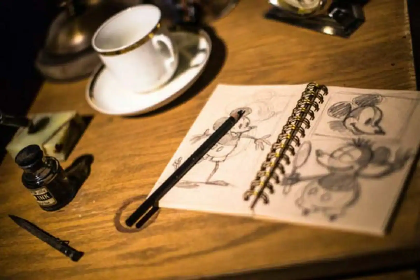 Micky Mouse drawn on a pad of paper