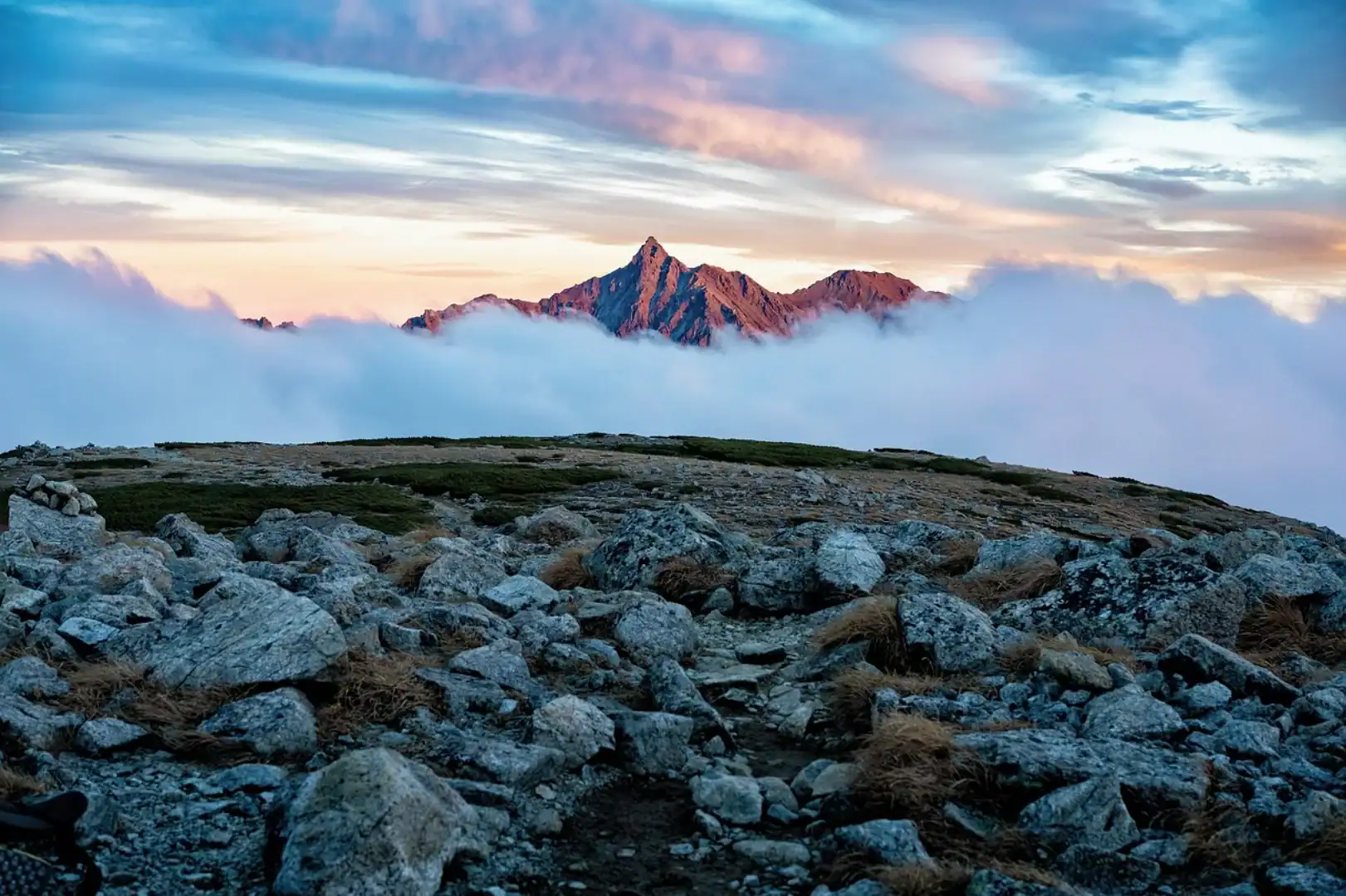 Rolling fog around base of mountain